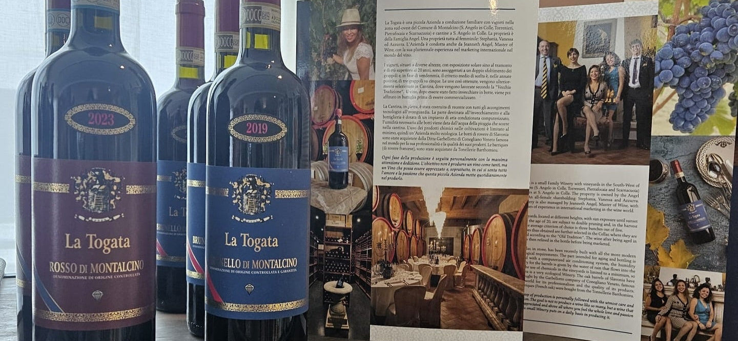 Bottles of La Togata Rosso di Montalcino wine on a table with promotional material.