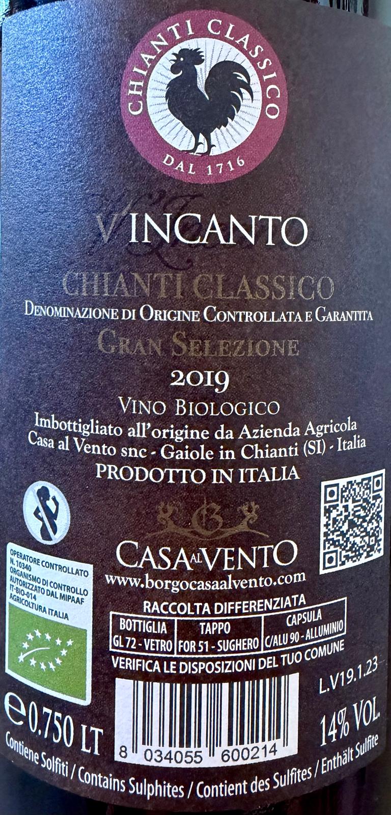 Close-up of a wine label for Chianti Classico Vincanto by Casa Vento, showing the rooster logo, product details, barcode, and Italian text on a dark background.